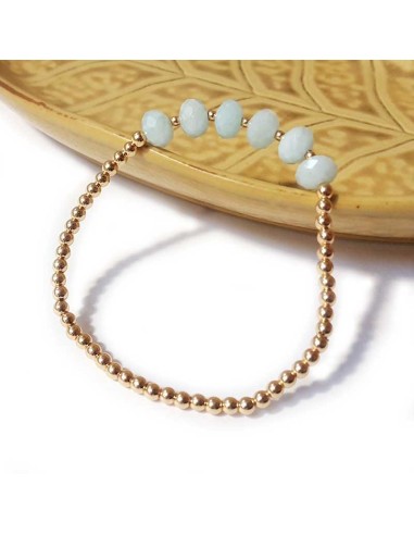 Bracelet with gold beads and faceted aquamarine