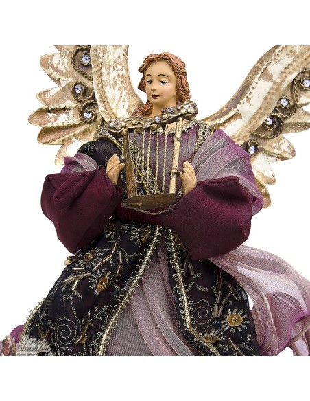 Ange métal doré et robe tissu rouge 