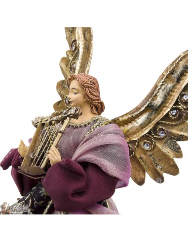 Ange métal doré et robe tissu rouge 